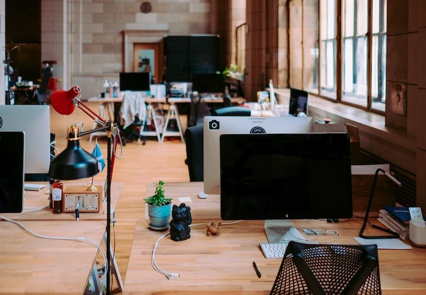 Office space with desks and glass doors